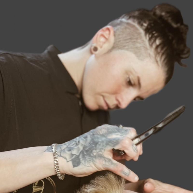 Taylor Corbett demonstrating precision barbering technique
