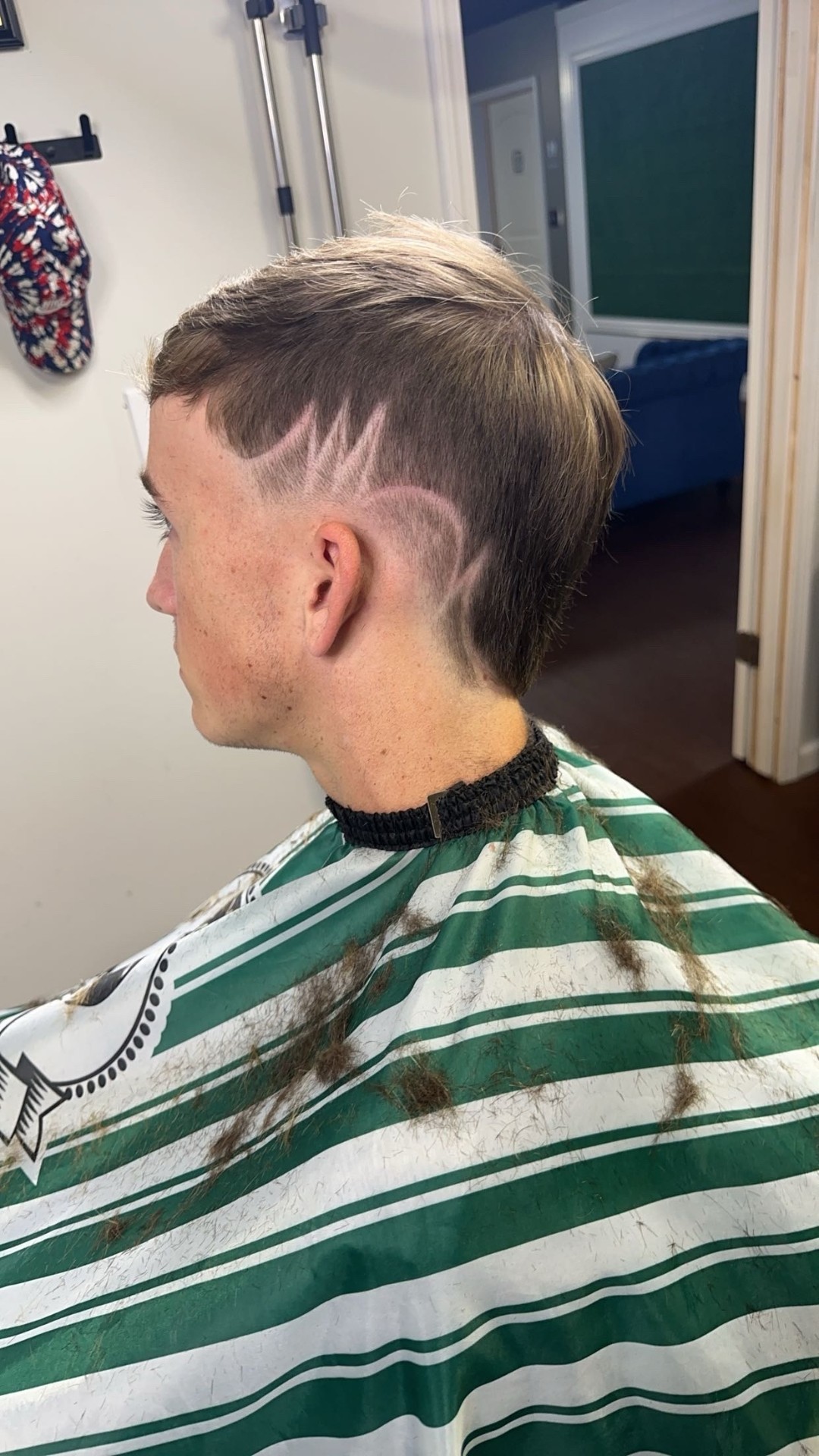 Modern fade haircut showing detailed clipper work